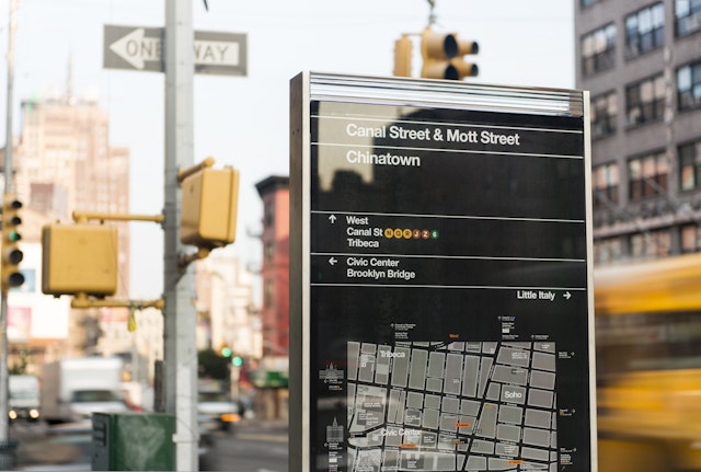The signs are designed to guide users to public transit and major landmarks.
